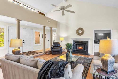 a living room with a couch and a fireplace at Resort Palm Retreat in Wesley Chapel