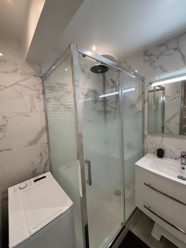 a bathroom with a shower and a sink at Apartment Juan Les Pins in the heart of town with its merchants in Juan-les-Pins