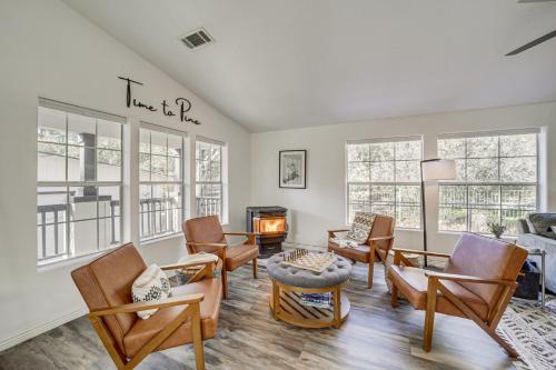 a living room with chairs and a fire place at Mtn Views and Playground Family-Friendly Pine Cabin in Pine