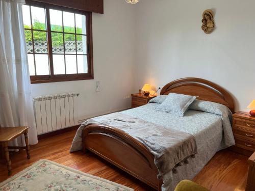 Ένα ή περισσότερα κρεβάτια σε δωμάτιο στο CASA DEL PALMERAL EN ORTIGUEIRA
