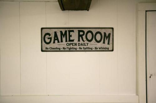 a game room sign on a white wall at Walk To Parks, Dining & Lake! Game Room! Hot Tub! in Watkins Glen