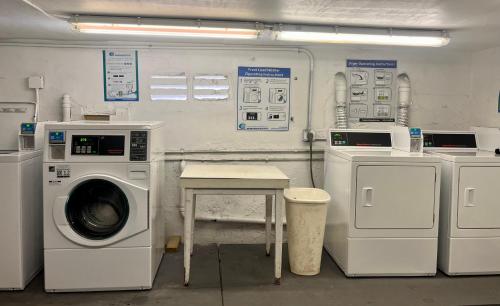 a laundry room with a washing machine and other appliances at Ocean Dream in Miami Beach