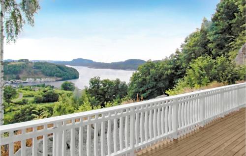 a balcony with a view of a river at Lovely Home In Fister With Wifi in Fister