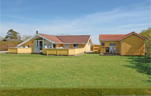 a house with a large yard in front of it at Holiday Home Drejet Rudkøbing V in Spodsbjerg