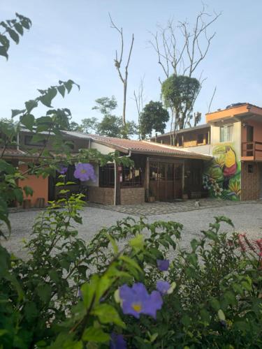 a building with a mural on the side of it at Pousada Dona Carmem Ubatuba in Ubatuba