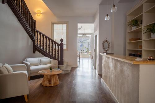 a living room with a couch and a table at Divino Hotel Boutique in Sitges