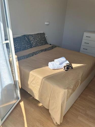 a bedroom with a bed with a towel on it at Il campanile in Scafati