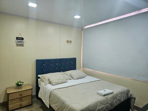 Tempat tidur dalam kamar di Roma Lodges House - Turin- Campin Movistar Embajada cubo colsubsidio