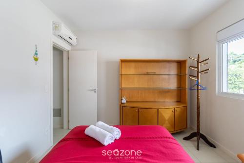 En eller flere senger på et rom på Triplex em condomínio próximo da Lagoa ARC003