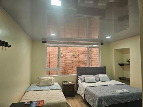 Ένα ή περισσότερα κρεβάτια σε δωμάτιο στο Roma House V- Campin Movistar El Cubo