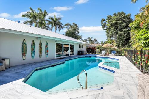 a swimming pool in the backyard of a house at Family Friendly Fort Myers Vacation Rental with Pool in Fort Myers