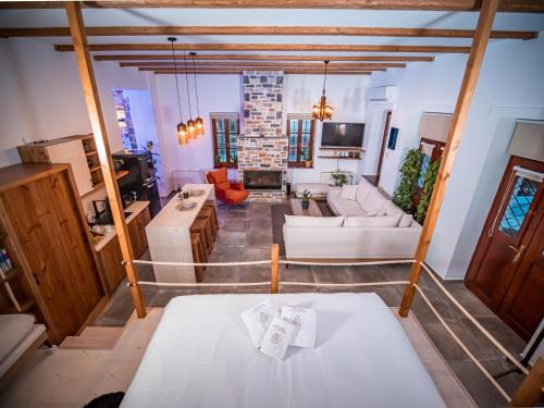 a large living room with a white couch and a living room at SELO Luxury Suite in Álli Meriá
