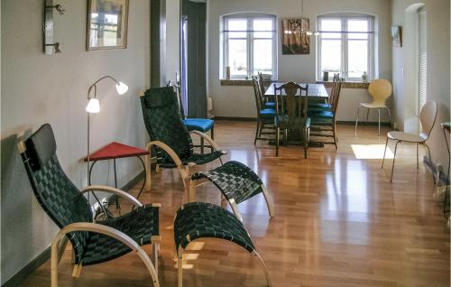 a room with chairs and a table and a dining room at Holiday Home Nr Landevej Sydals Xi in Kegnæshøj