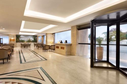 a lobby of a hotel with a dining room at Hilton Copacabana Rio de Janeiro in Rio de Janeiro