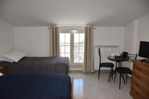 Postel nebo postele na pokoji v ubytování Monte Cucco B&B