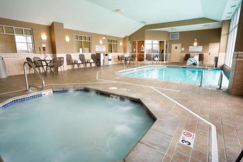 a large swimming pool in a hotel room at Drury Inn & Suites Columbus Grove City in Grove City