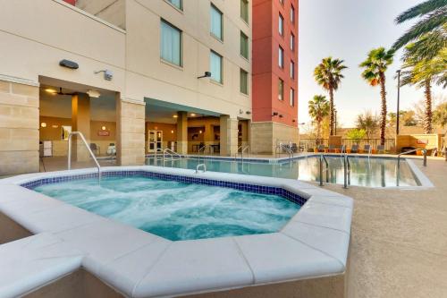 a hot tub in front of a building at Drury Inn & Suites Orlando near Universal Orlando Resort in Orlando