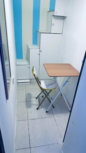 a desk and a chair in an office at Khansaheb Residence in Dubai