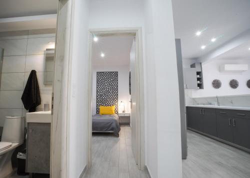 a bathroom with a sink and a bed in a room at Rodini House in Rhodes Town