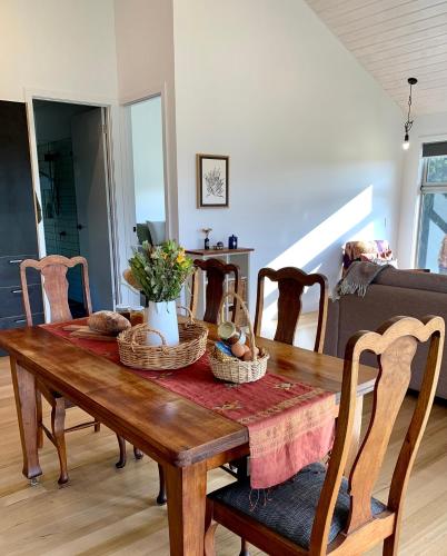 a dining room table with baskets on top of it at Sundays in Middleton