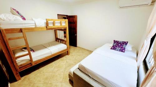 a small room with two bunk beds in it at LIVE APARTMENTS Cartagena in Cartagena de Indias