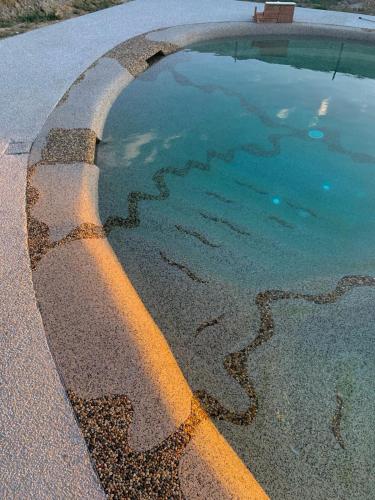 a pool of water with a yellow line in it at Dimora Toscana in Treggiaia