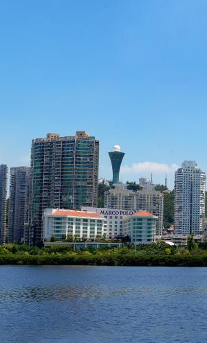a view of a city with buildings and the water at Marco Polo Xiamen in Xiamen