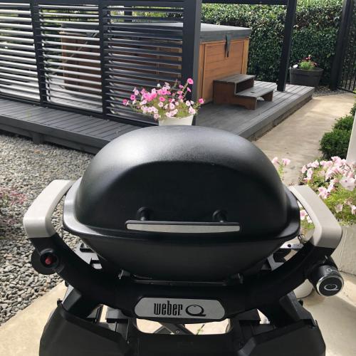 a black helmet sitting on the seat of a motor scooter at Vista - touch of country and hot Spa in Havelock North