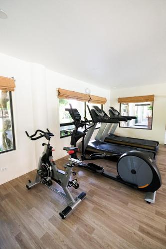 a gym with two exercise bikes in a room at Bluewater Maribago Beach Resort in Mactan
