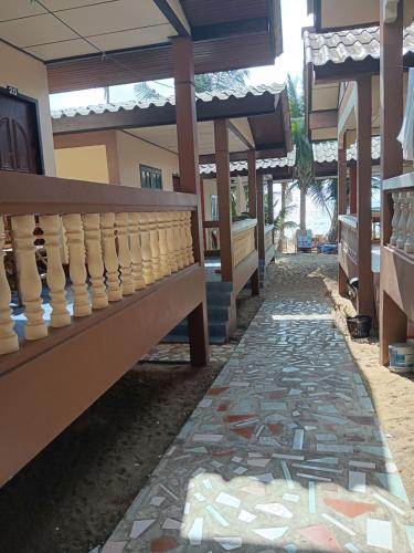 a walkway in front of a building with mosaics at Paradise Bungalows Lamai Beach in Koh Samui 