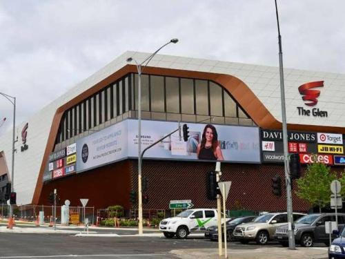 a building with a billboard on the side of it at 5 BR & 3 BTH House in Outlook Glen w/ 2 car parks in Glen Waverley