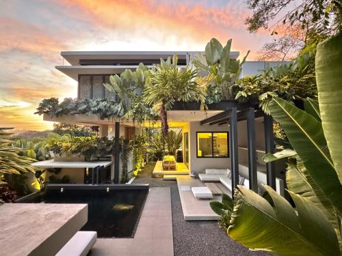 an exterior view of a house with plants at KUNUK- Walk to Hermosa beach in Santa Teresa Beach