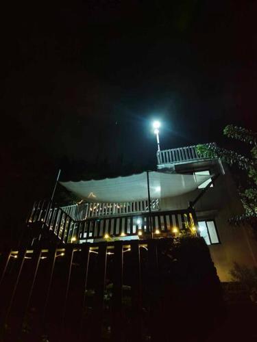 a building with a light on top of it at night at Tanay Private Staycation house in Tanay