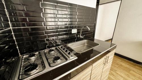 Kuchyň nebo kuchyňský kout v ubytování Apartamentos FM Loft 303