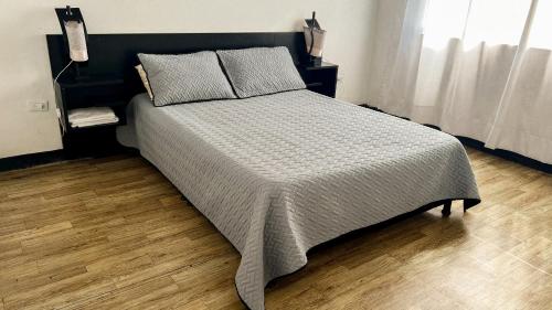 Postel nebo postele na pokoji v ubytování Apartamentos FM Loft 303