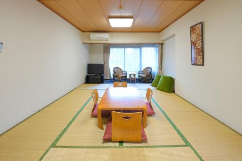 a room with a table and chairs on the floor at Hakone Forest of Verde in Hakone