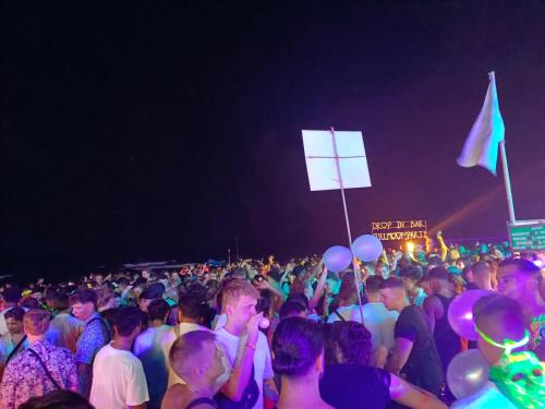 a large crowd of people at a party at night at Haadrin village Fullmoon in Haad Rin
