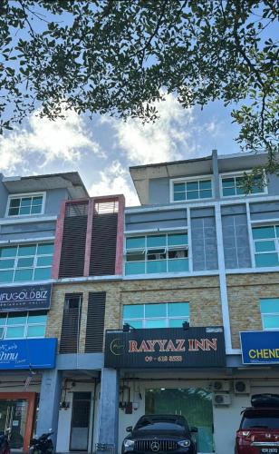 a building with a sign on the front of it at Rayyaz Inn in Kuala Terengganu