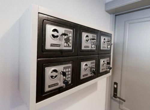a bunch of electrical outlets on the wall of a bathroom at Ösel Apartment - great for couples, friends and families in Kuressaare
