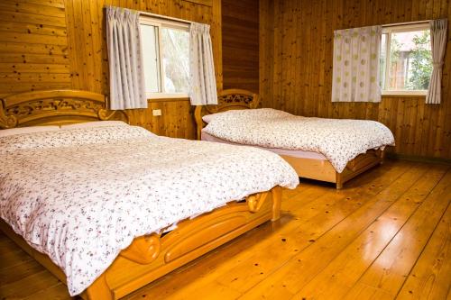 Un ou plusieurs lits dans un hébergement de l'établissement Fong Chou Chalet