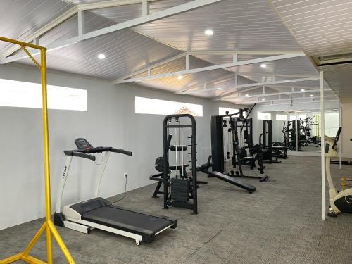 a gym with several treadmills and exercise bikes at Hotel 168 Salatiga in Salatiga
