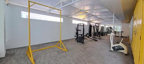 a gym with treadmills and equipment in a room at Hotel 168 Salatiga in Salatiga