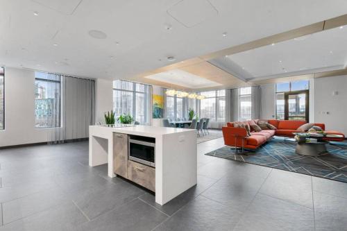 a living room with a couch and a table at Boston VIP Club Quarters by Orchard Group in Cambridge