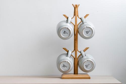 a group of clocks on a wooden stand at Taitung Spring Homestay B&B in Taitung City