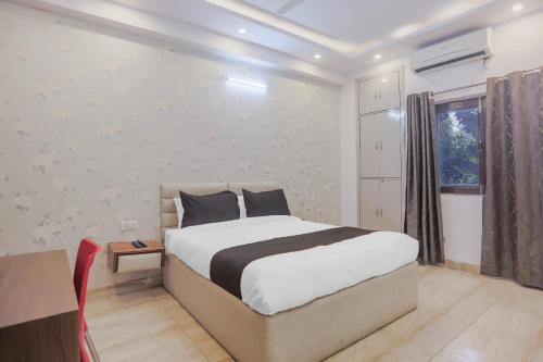 A bed or beds in a room at Hotel Essendi Hospitalities Llp