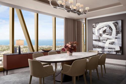 a dining room with a table and chairs at The Ritz-Carlton, Melbourne in Melbourne