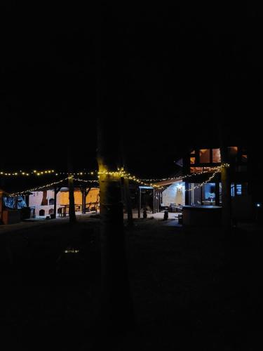 a night time view of a building with lights at Misha's House in Porumbacu de Sus
