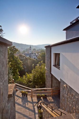 a view from the balcony of a building at Urocza Art Pensjonat in Krynica Zdrój