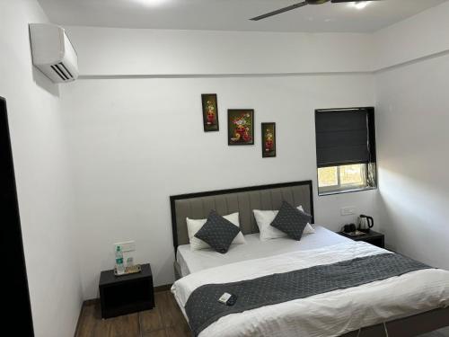 Ένα ή περισσότερα κρεβάτια σε δωμάτιο στο Sunny Executive