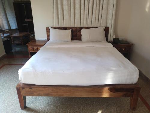 Postel nebo postele na pokoji v ubytování Kumbhalgarh Fort Resort